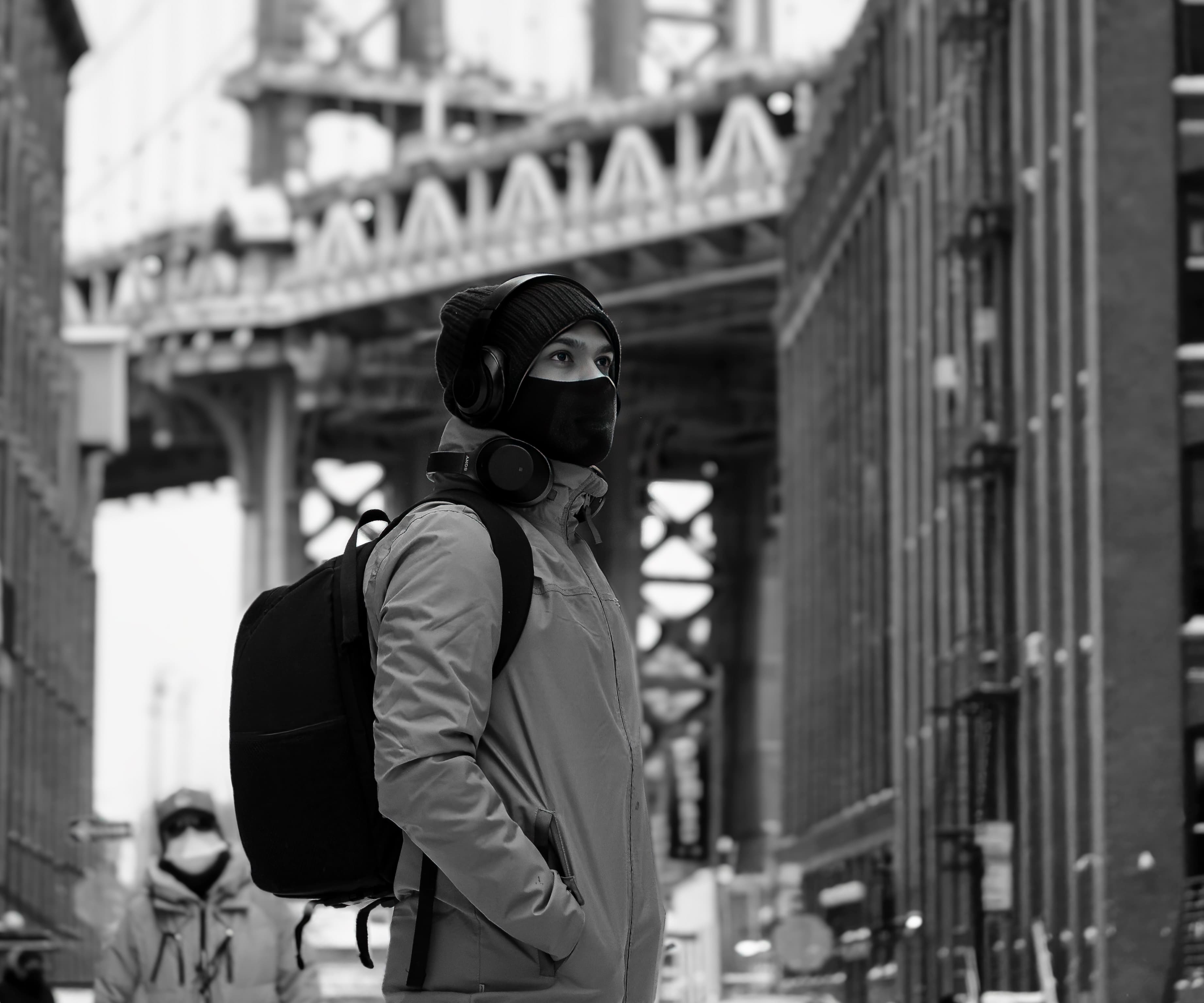 Krishna Dubagunta standing before the DUMBO bridge in Brooklyn
