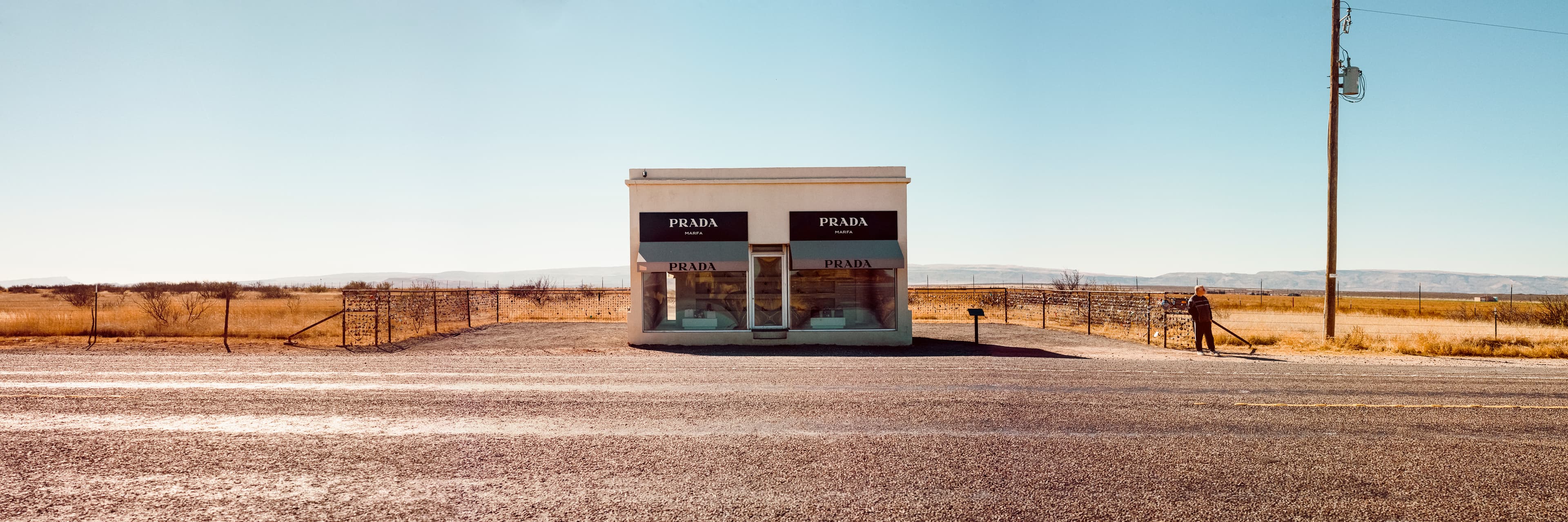 Discover the unexpected intersection of luxury and the wilds of the desert with this panoramic shot captured with a Hasselblad 500 C/M from the iconic Prada store on a deserted highway in Texas. Immerse yourself in the serenity of the deserted highway and the latest collections from Prada. Experience the height of fashion amidst the #nature with this stunning landscape photography panorama shot.